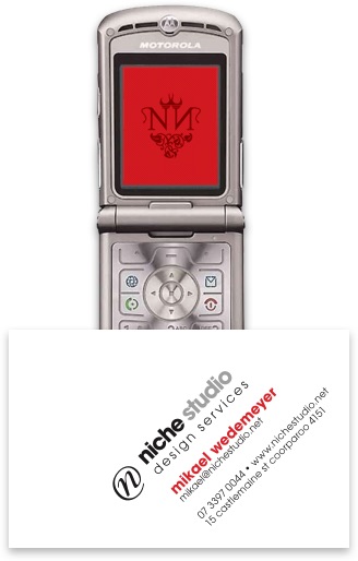 Mikael’s business card for Niche Studio circa 2006 overlapping a Motorola Razr phone displaying a red logo.